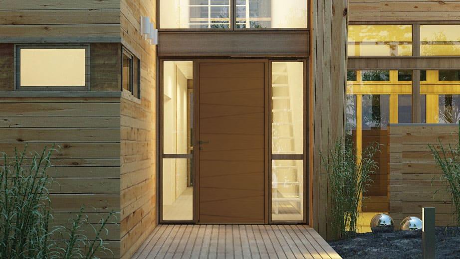 La porte d’entrée en bois gamme Contemporaine de la marque BREMAUD laisse la priorité à la lumière dans votre habitation